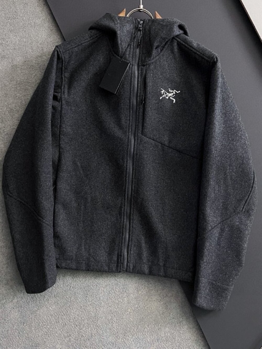 Arc'teryx Sawyer Wool Hoody in black, made with Merino wool.